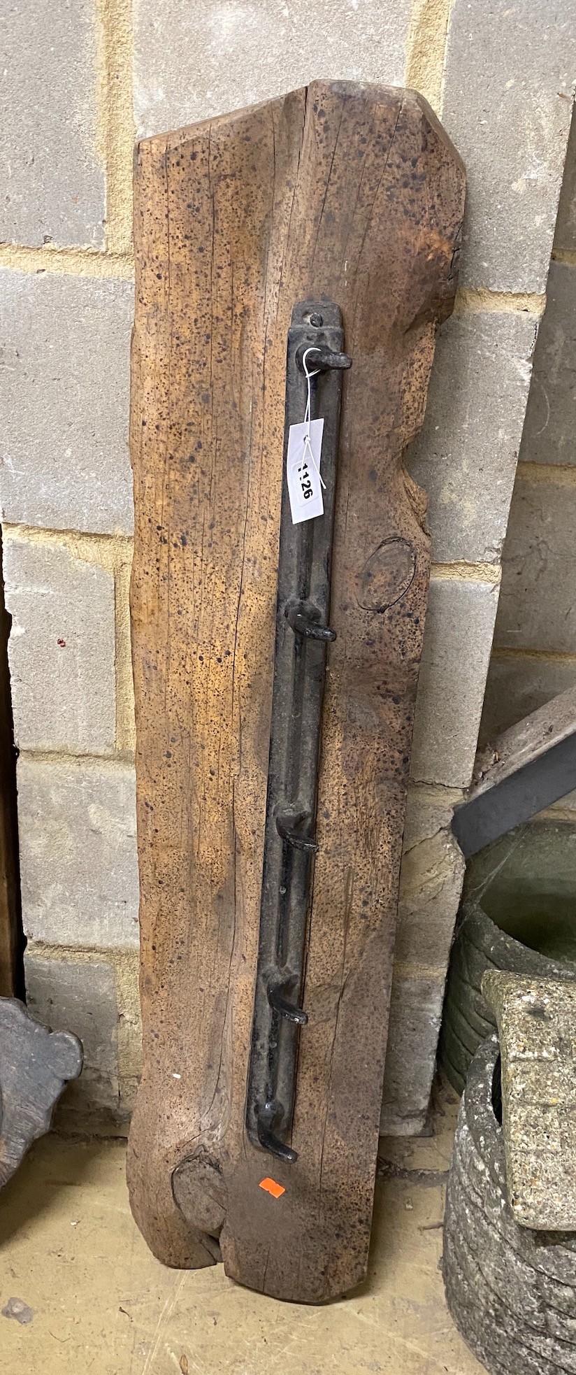A provincial wrought iron and wood coat rack, width 107cm